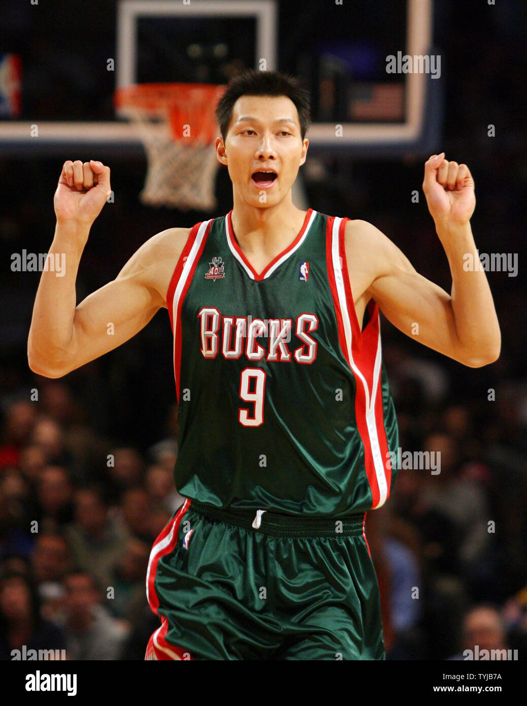 Milwaukee Bucks Yi Jianlian puts his fists in the air while running up the  court in the second quarter against the New York Knicks at Madison Square  Garden in New York City