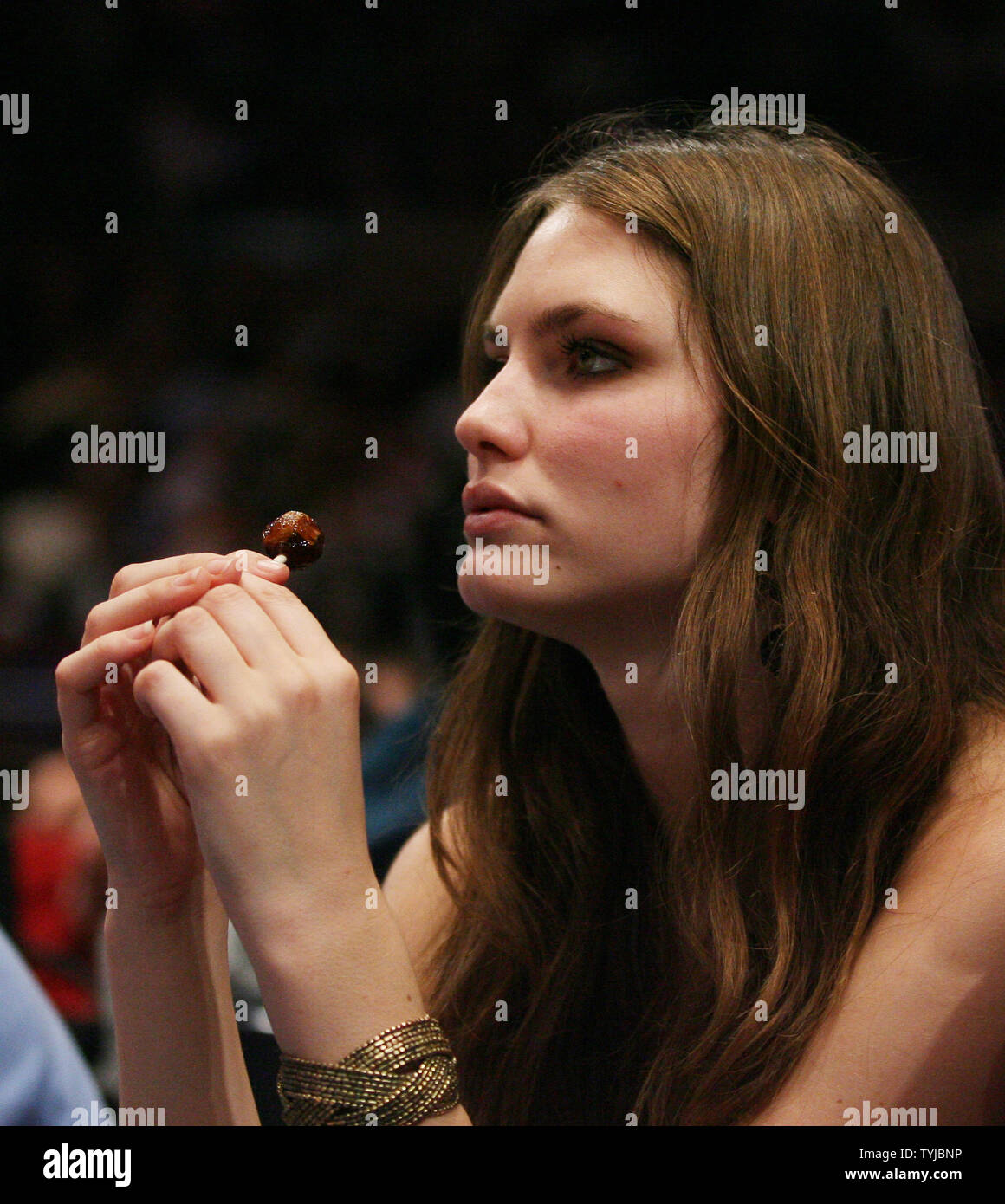 Kristy McQuade has a lollypop at the New York Knicks Seattle Supersonics game at Madison Square Garden in New York City on December 12, 2007. The Seattle SuperSonics defeated the New York Knicks 117-110.   (UPI Photo/John Angelillo) Stock Photo
