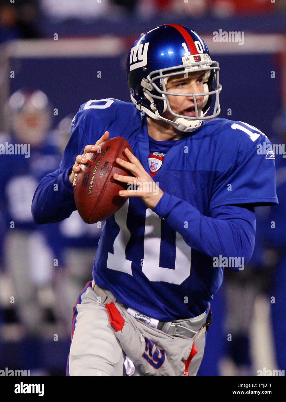 New York Giants starting quarterback Eli Manning rolls out to the right  against the Washington Redskins in the first quarter at Giants Stadium in  East Rutherford, New Jersey on December 16, 2007. (