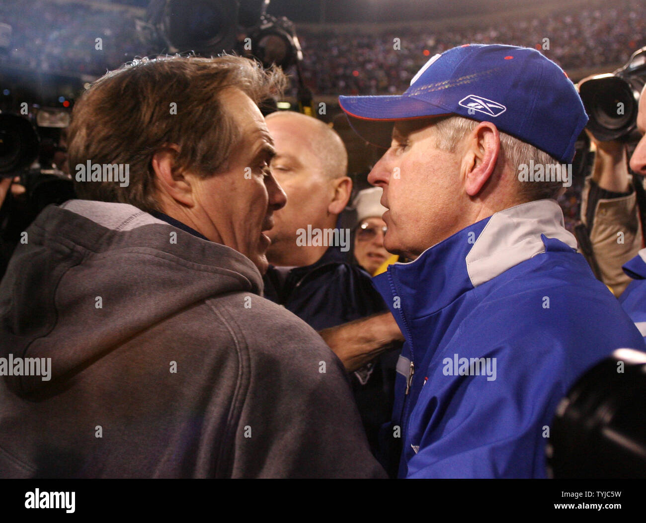 New York Giants head coach Tom Coughlin and New England Patriots head coach Bill Belichick (L) exchange words after the game at Giants Stadium in East Rutherford, New Jersey on December 29, 2007. The Patriots defeated the Giants 38-35 and finished the regular season at 16-0.   (UPI Photo/John Angelillo)      . Stock Photo