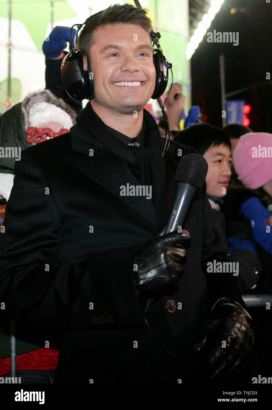 American Idol host Ryan Seacrest does a live broadcast spot before people gathered in Times Square to celebrate New Year's Eve on January 1, 2008 in New York. (UPI Photo/Monika Graff). Stock Photo