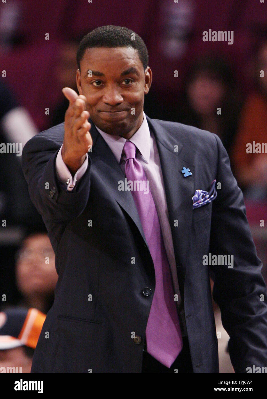 New York Knicks head coach Isiah Thomas sticks his hand out while coaching in the first quarter against the Detroit Pistons at Madison Square Garden in New York City on January 13, 2008.  (UPI Photo/John Angelillo)   . Stock Photo
