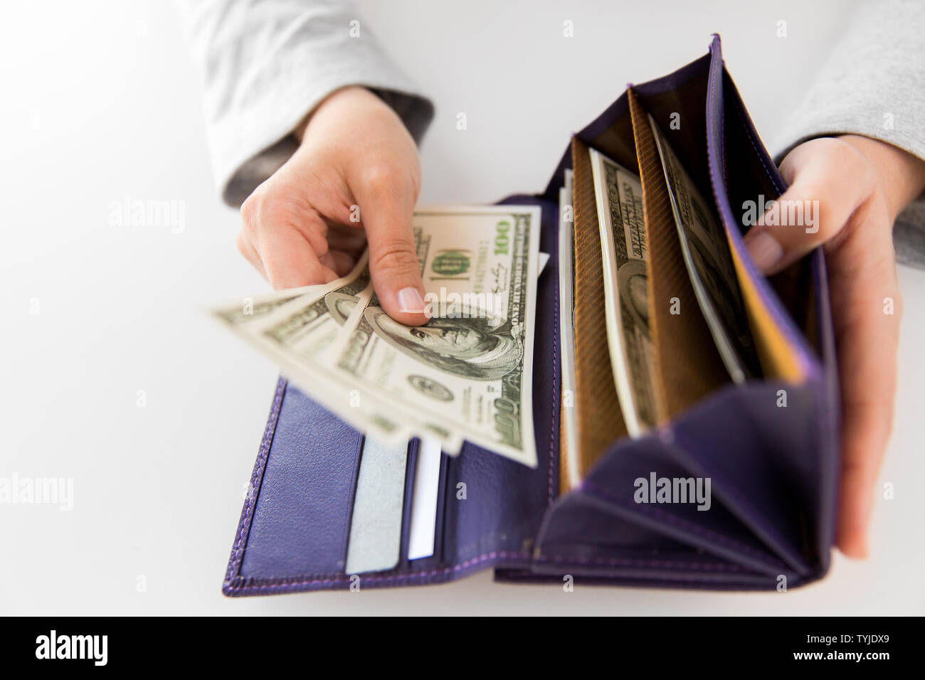 close up of woman hands with wallet and us money Stock Photo