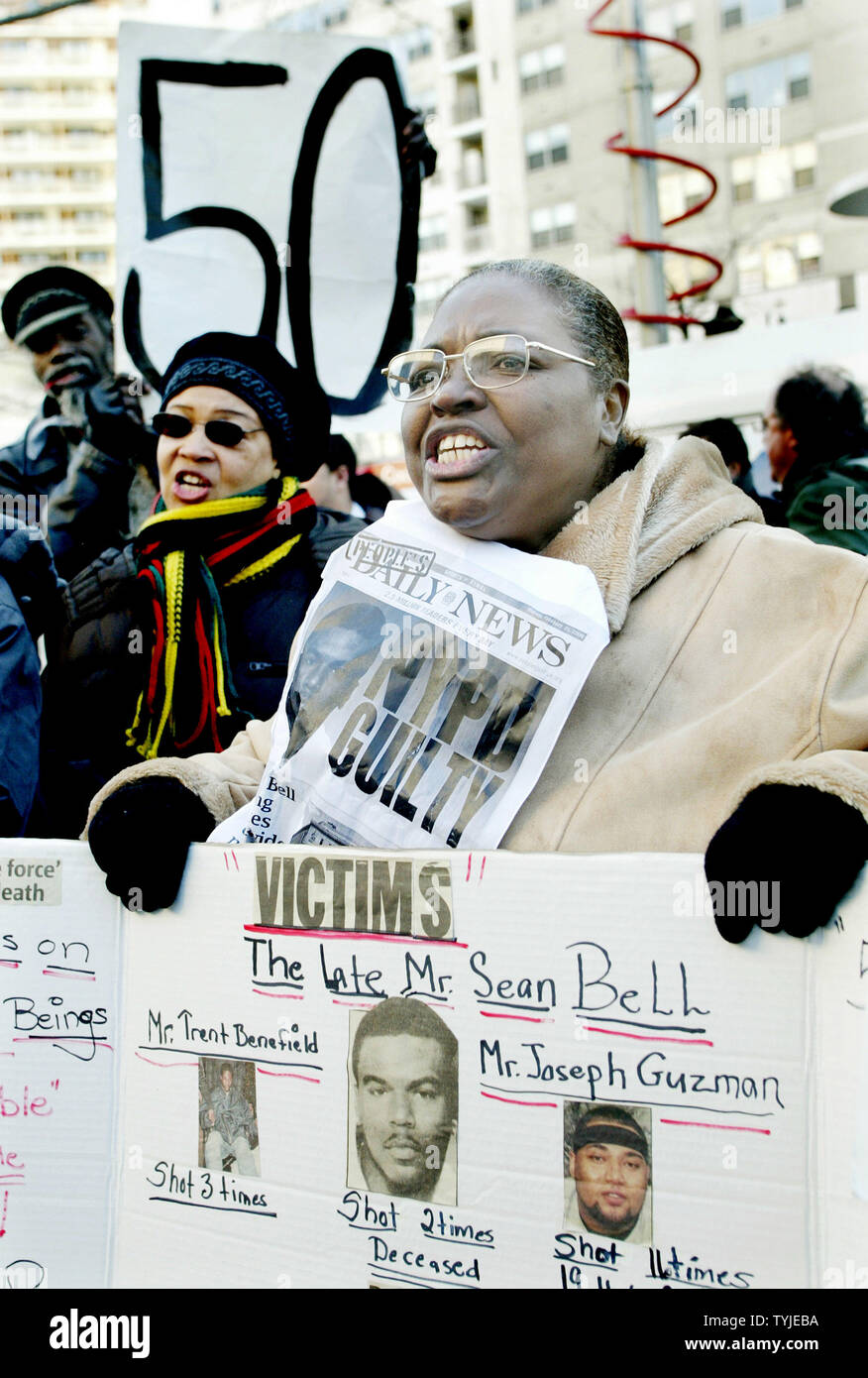 Renee Harris-Pinkney (R) joins protesters gather before the Queens County Criminal Court where the trial has begun for the three New York City Police officers involved with the shooting death of Sean Bell on February 25, 2008 in the borough of Queens in New York. Bell, who was unarmed, was killed in a hail of 50 bullets outside of a strip club on the eve if his wedding in November, 2006.  (UPI Photo/Monika Graff) Stock Photo