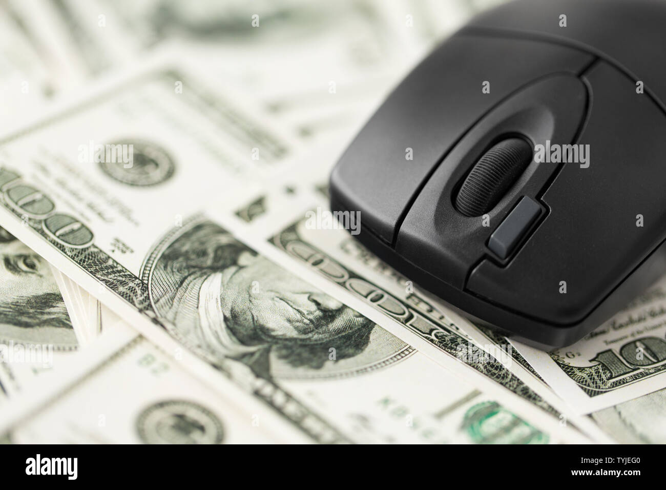 close up of computer mouse on us dollar money Stock Photo