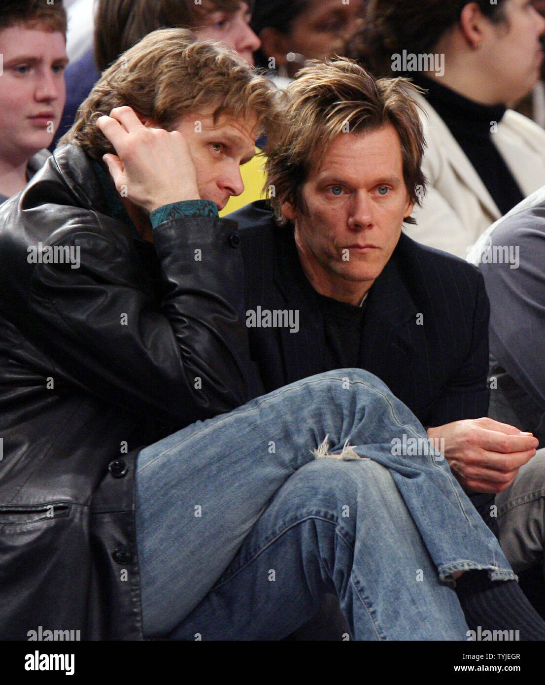 Kevin Bacon (R) watches the New York Knicks play the Charlotte Bobcats at Madison Square Garden in New York City on February 27, 2008. The Knicks defeated the Bobcats 103-89.    (UPI Photo/John Angelillo) Stock Photo