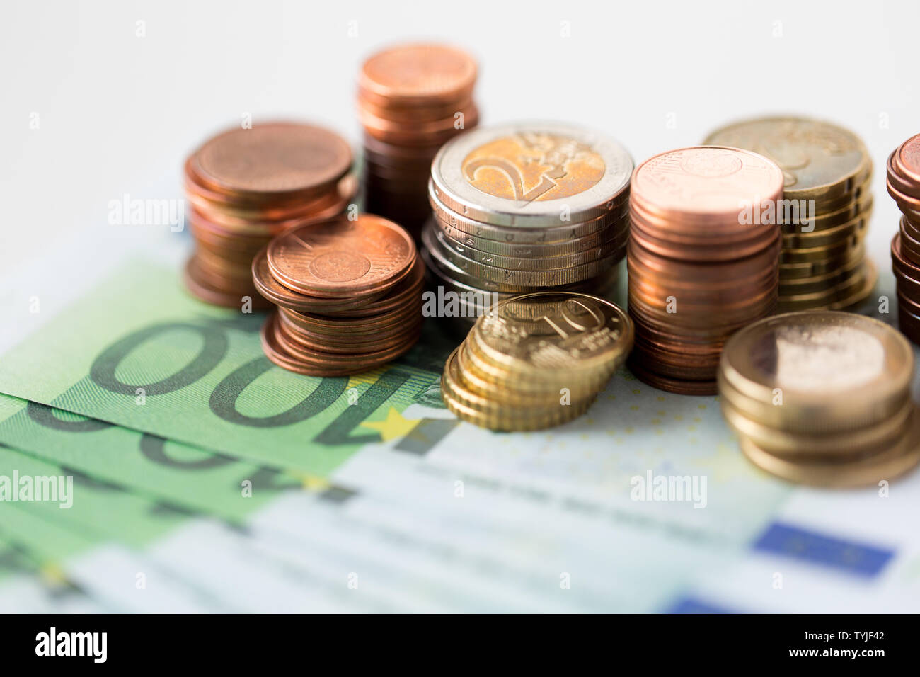 close up of euro coins and paper money banknotes Stock Photo