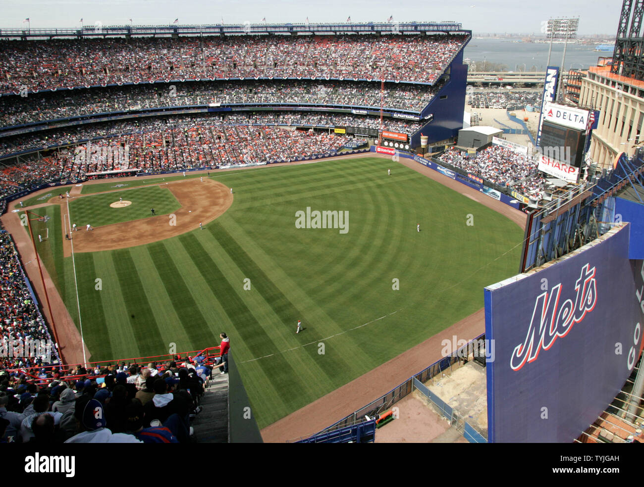 Fans gather to watch the New York Mets play their last home opener at ...