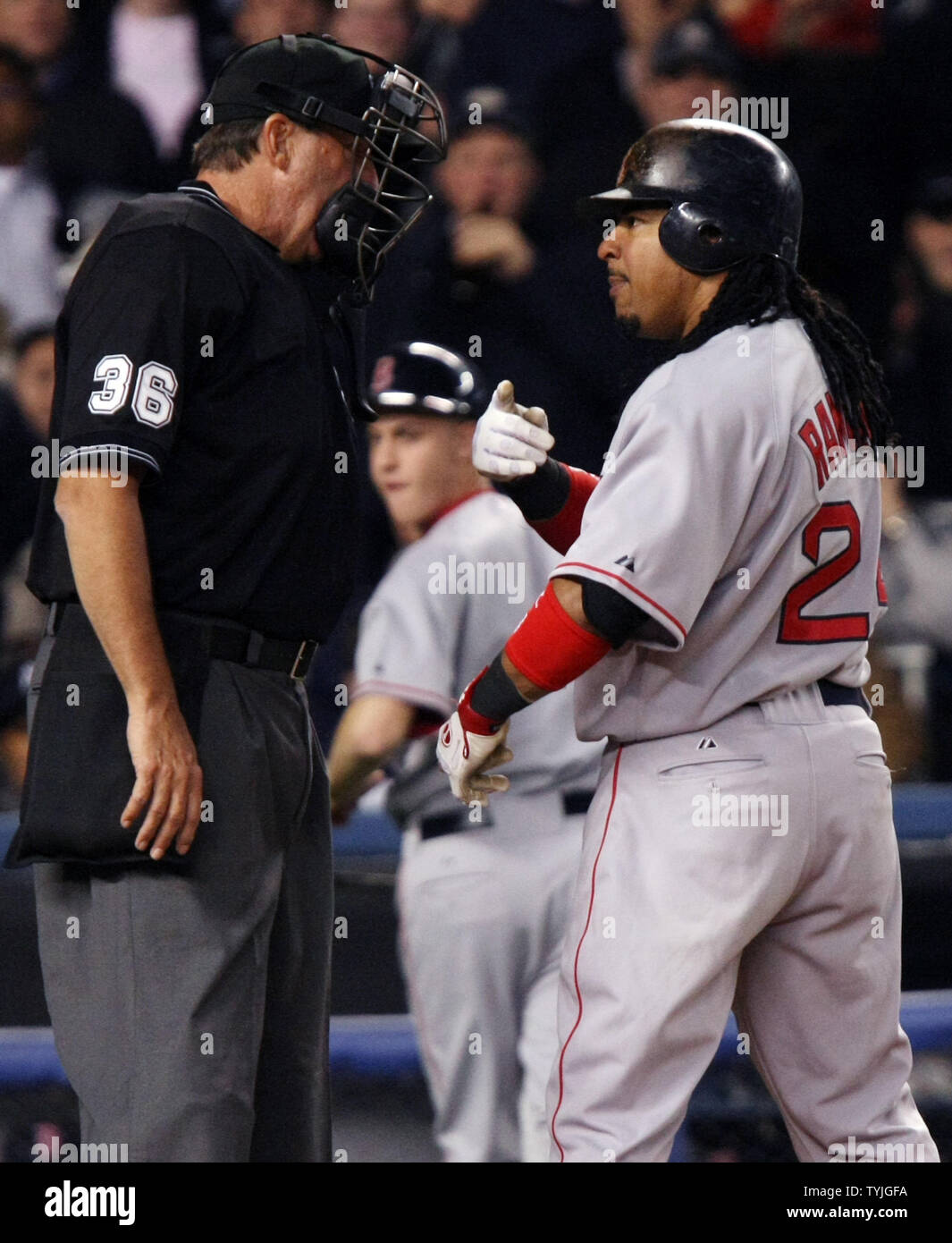 Chicago Cubs manager Lou Piniella (R) argues with home plate umpire Ed  Rapuano (C) after Rapuano ejected Jim Edmonds for arguing ball and strikes  during the 11th inning against the Milwaukee Brewers