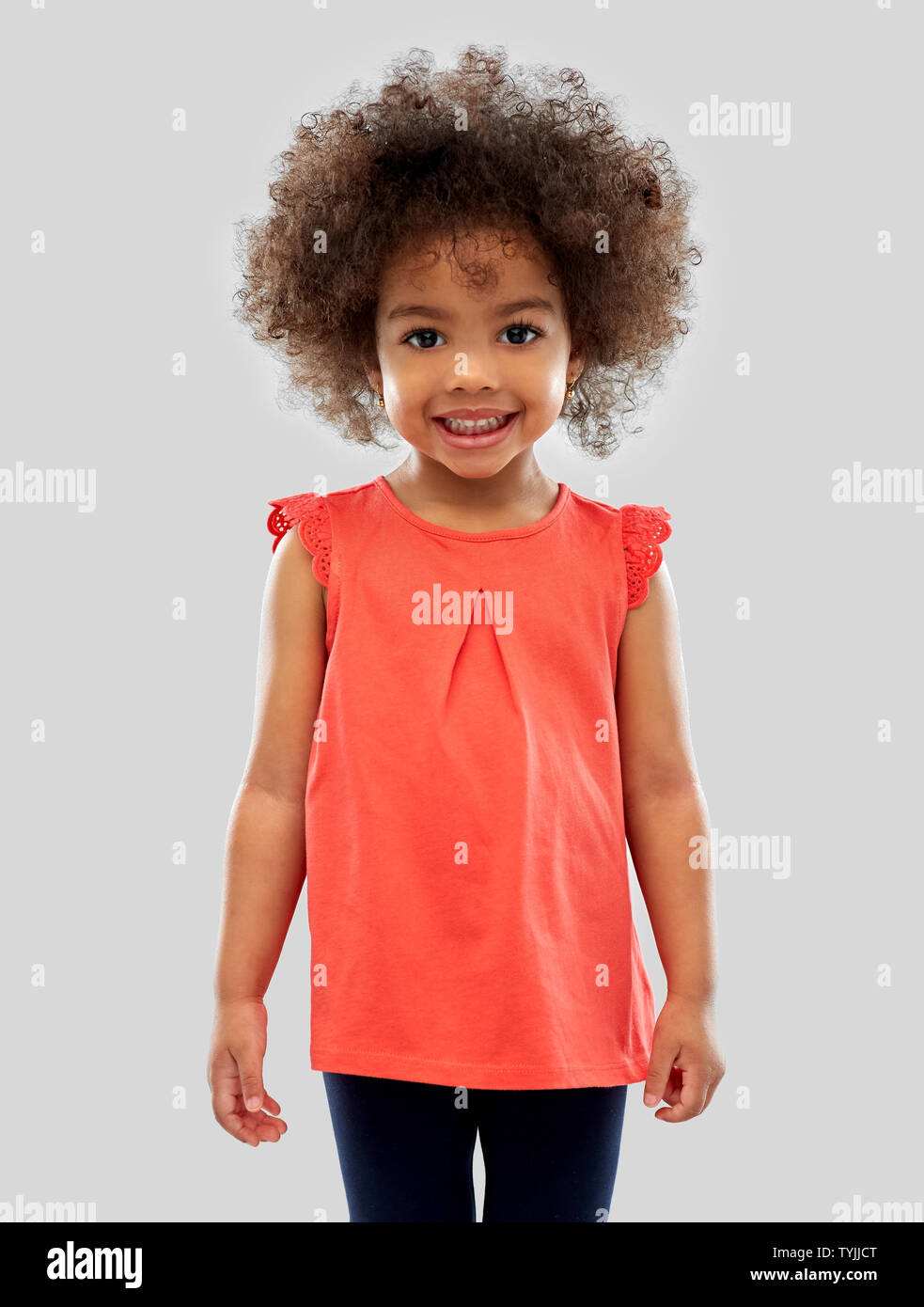 happy little african american girl over grey Stock Photo - Alamy