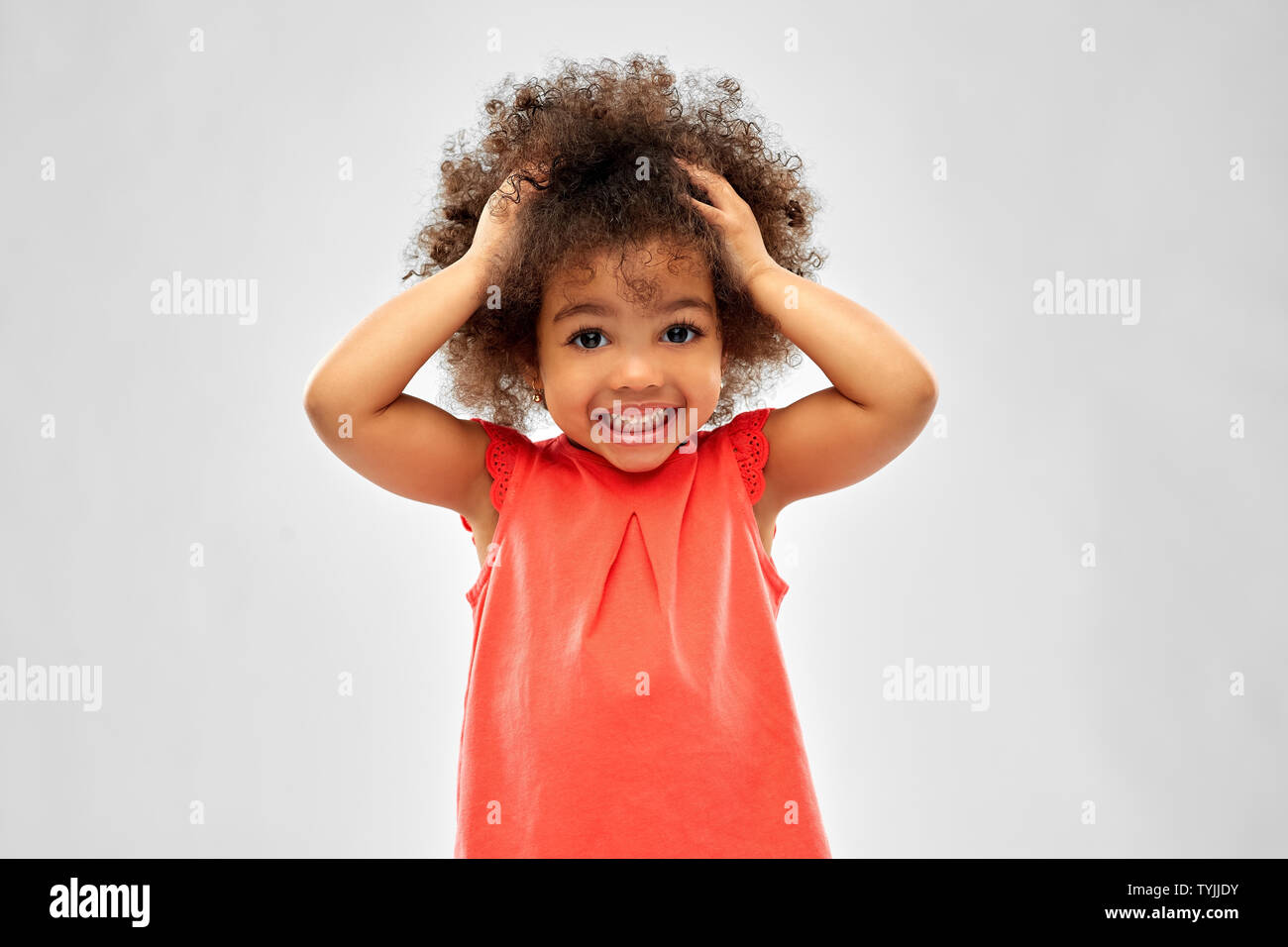 overwhelmed african american girl holding to head Stock Photo