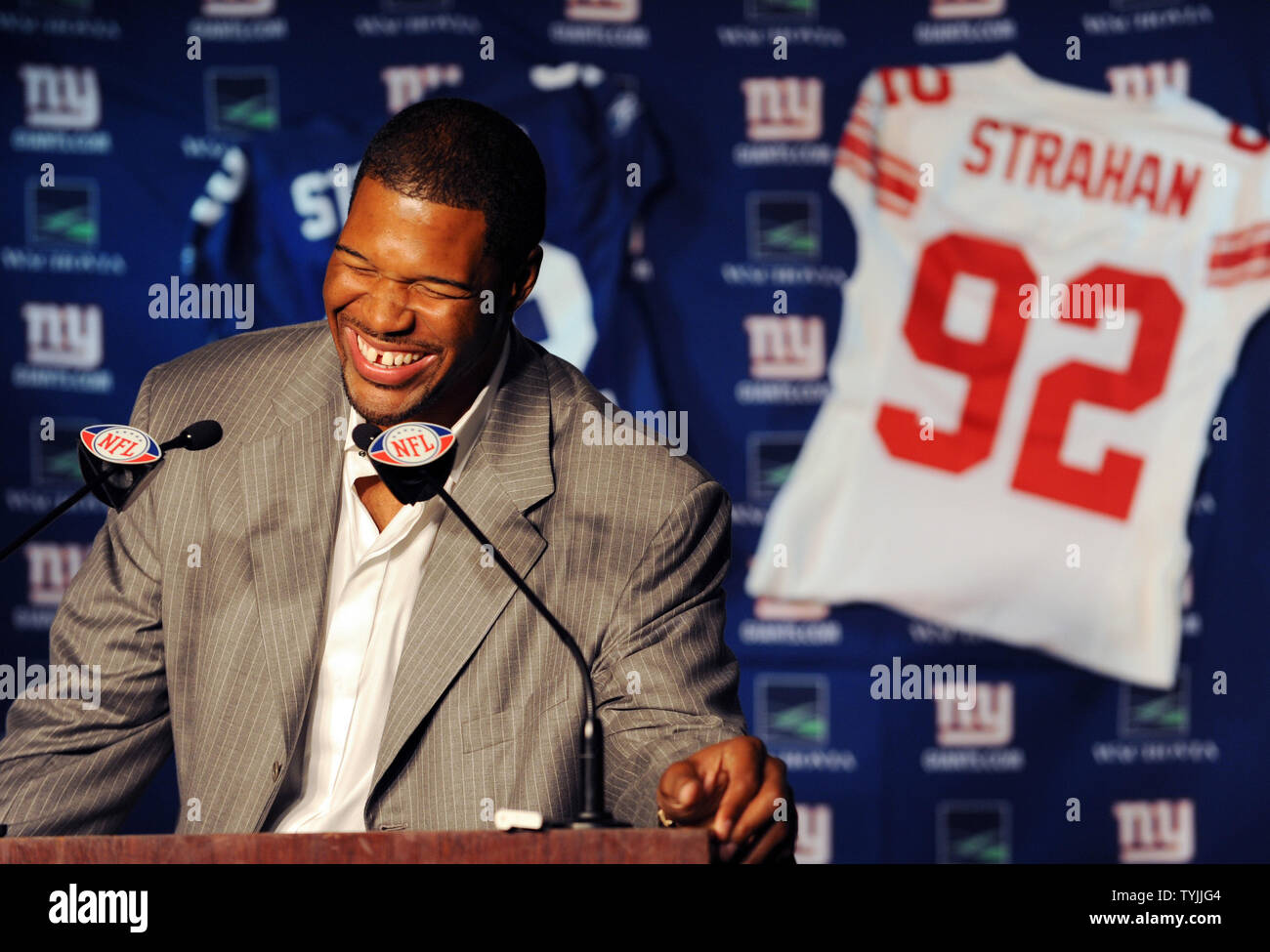 New York Giants Michael Strahan laughs at his retirement press conference at Giants Stadium in East Rutherford, New Jersey on June 6, 2008. Strahan retires after 15 years playing for the New York Giants in the NFL.      (UPI Photo/John Angelillo)      . Stock Photo