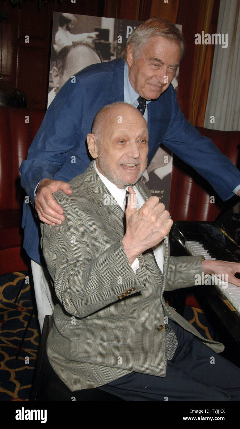 Lyrcist Lee Adams helps his partner composer Charles Strouse (l to r) of  the Broadway musicals: "Bye Bye Birdie, Golden Boy, Applause" celebrate his  80th birthday with a book party launch for