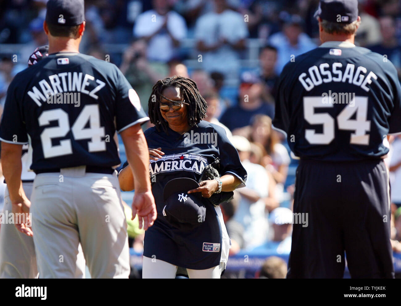 Whoopi Goldberg prepares to greet Tino Martinez and Rich 'Goose' Gossage at the .Taco Bell All-Star Legends & Celebrity Softball Game at Yankee Stadium in New York City on July 13, 2008.        (UPI Photo/John Angelillo) Stock Photo
