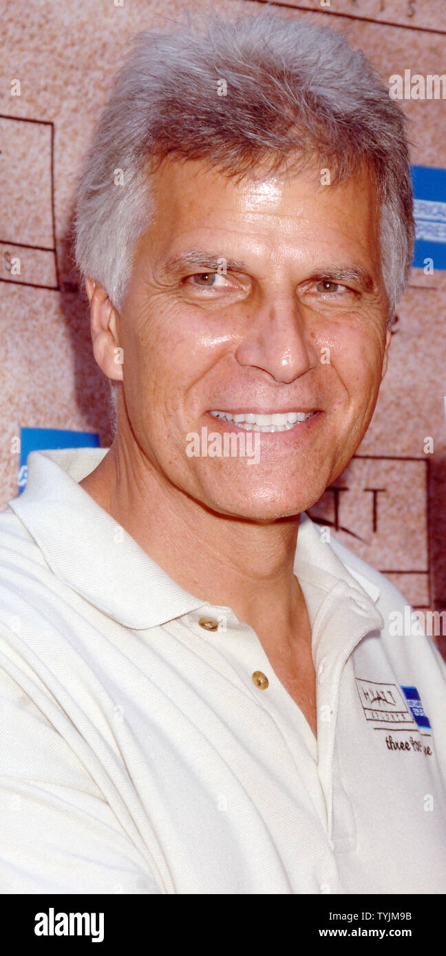 Olympic swimming champion Mark Spitz admires the cover of Sports Illustrated  magazine featuring Michael Phelps whose 8 gold medal wins at the Bejing China 2008 Olympics finally broke Spitz 1972 record of 7 gold. Spitz was at a promotional gig for the Grand Hyatt hotel in New York on August 20, 2008.   (UPI Photo/Ezio Petersen) Stock Photo