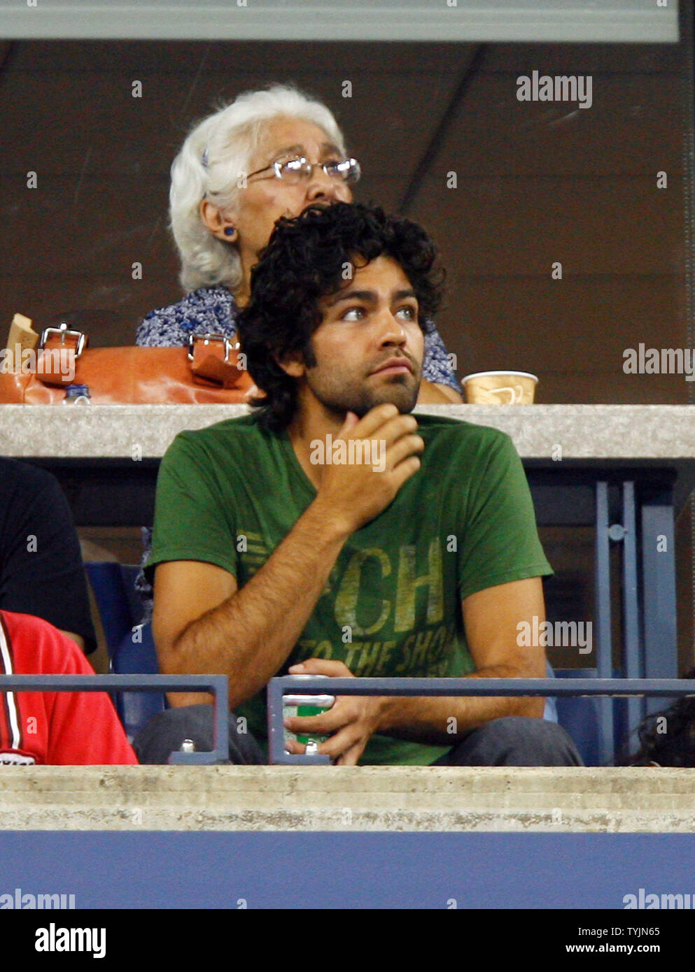 Entourage star, Adrian Grenier, watches Serena Williams play Severine Bremond on day eight at the U.S. Open Tennis Championships at the U.S. National Tennis Center in Flushing Meadows, New York on September 1, 2008. Williams defeated Bremond 6-2 6-2.         (UPI Photo/John Angelillo) Stock Photo