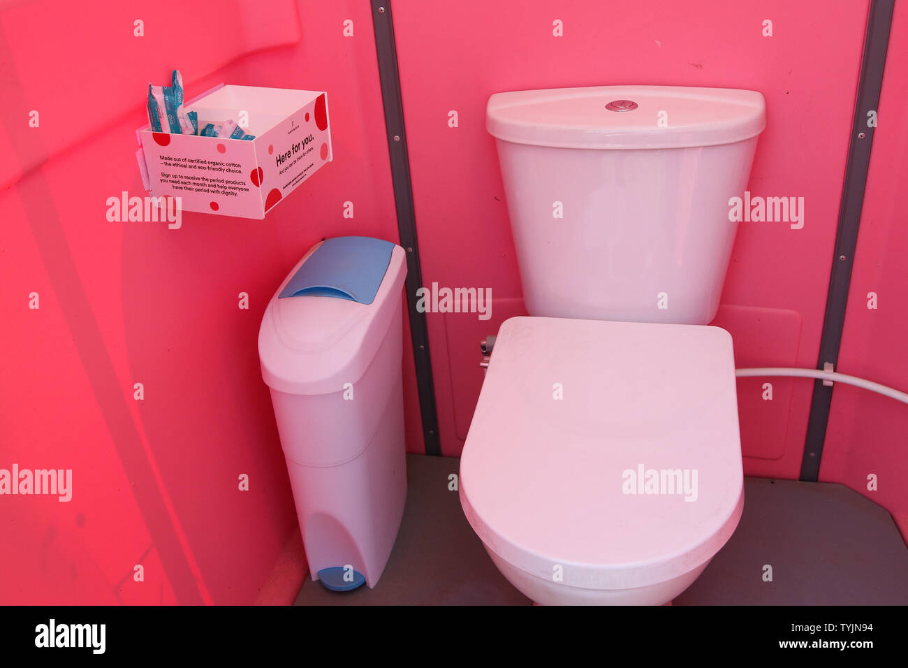 The female only toilets at Glastonbury Festival, at Worthy Farm in Somerset. Water aid has set up specially designed private cubicles to meet women's needs, with sanitary disposal facilities, water for washing, a shelf, hook and extra space. and female urinals where users are given a shepees have the option for biodegradable tampons. Stock Photo