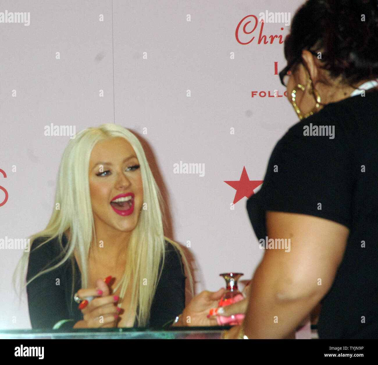 Actress/singer Christina Aguilera greets fans at the launch of her new ...