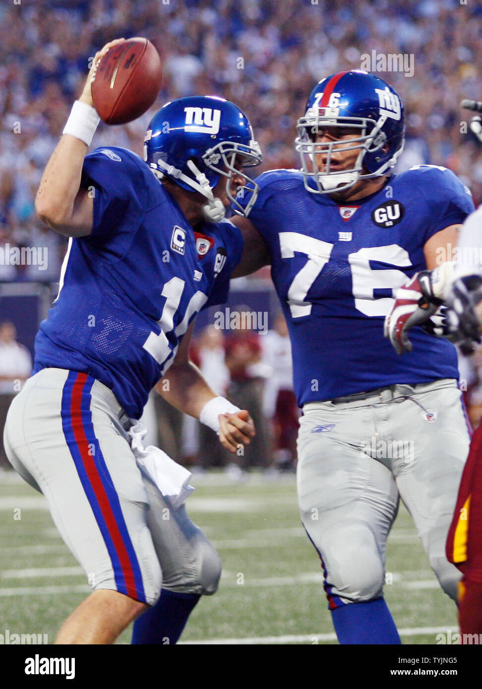 New York Giants Eli Manning and Chris Snee (76) react after a touchdown in  the first quarter against the Washington Redskins at Giants Stadium in East  Rutherford, New Jersey on September 4,