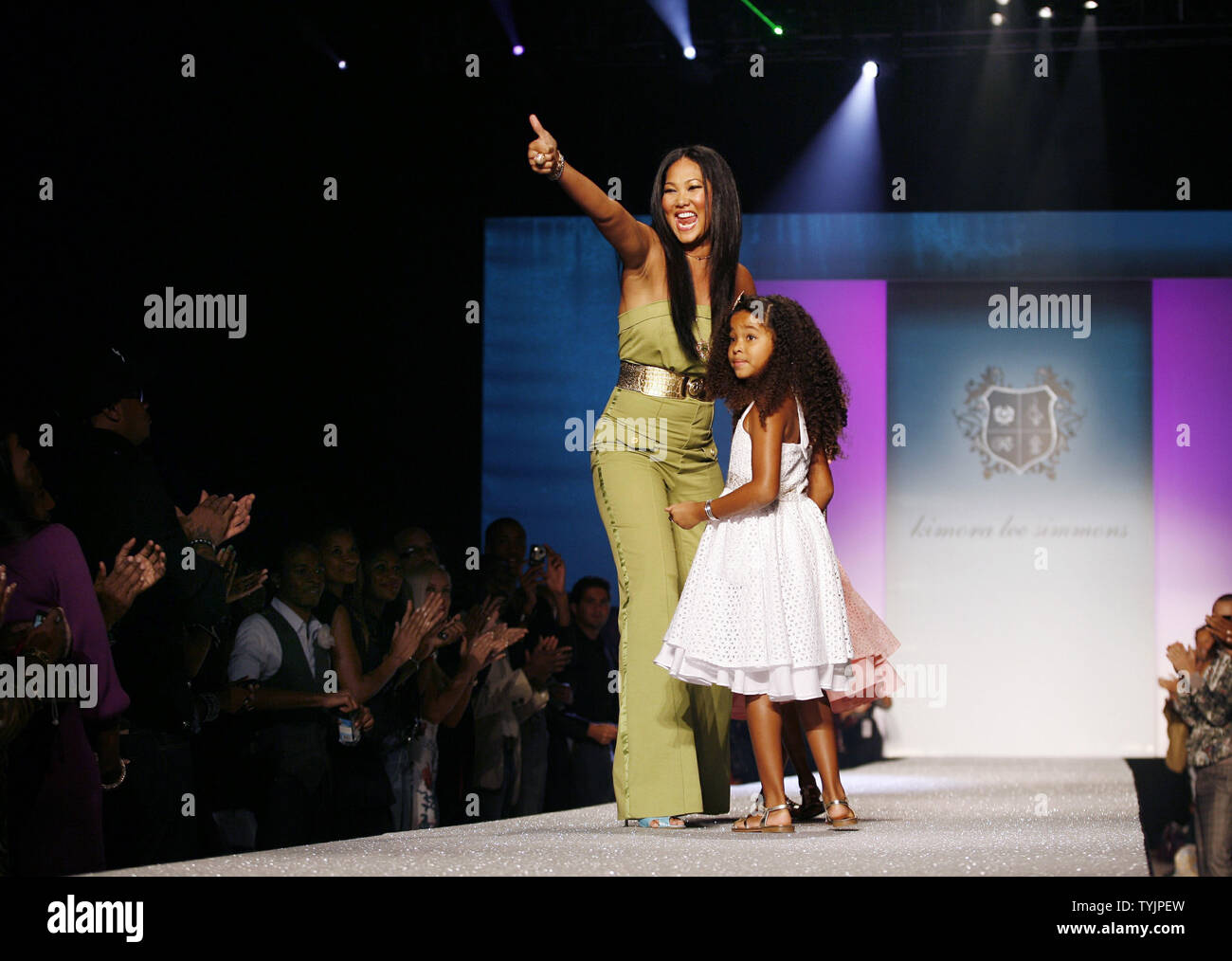 Kimora Lee Simmons walks out on the runway with children Ming and Aoki after the Baby Phat Decade fashion show at the Spring 2009 collections of Mercedes-Benz fashion week at Bryant Park in New York City on September 12, 2008.  (UPI Photo/John Angelillo)   . Stock Photo