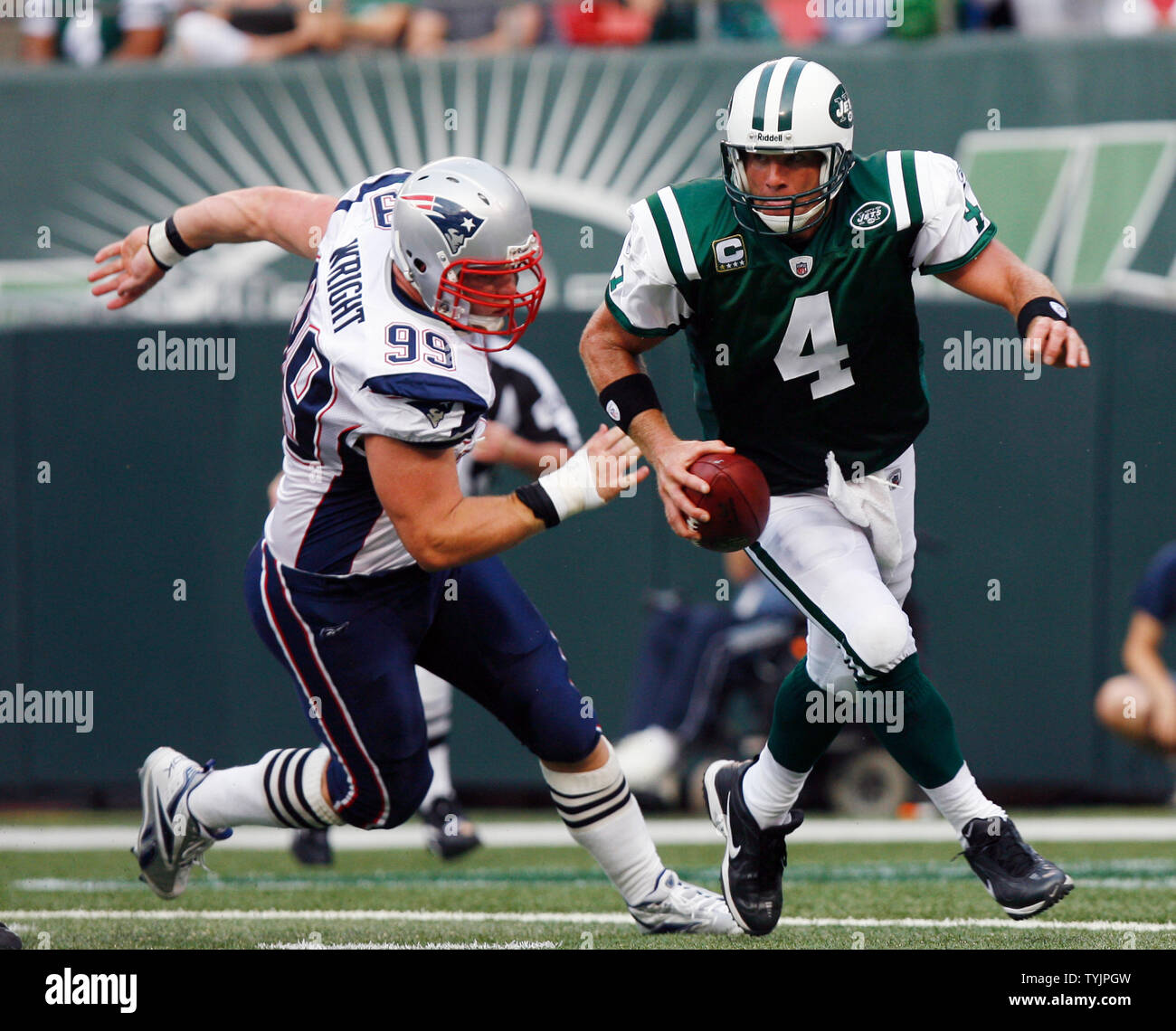 New York Jets Brett Favre runs from New England Patriots Mike