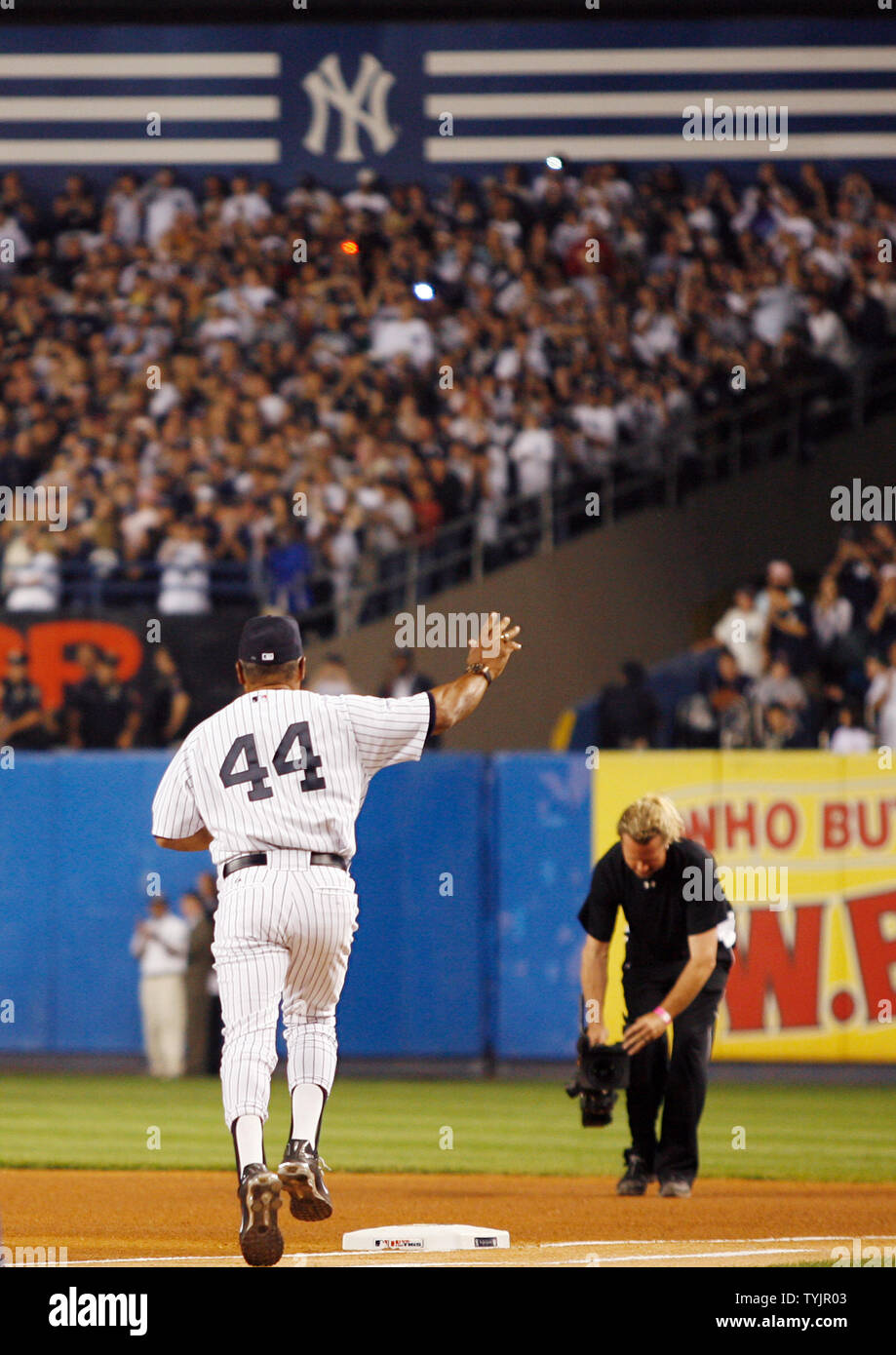 Reggie Jackson waves to fans at Yankee Stadium before the New York Yankees  play the Baltimore Orioles in the final game ever at Yankee Stadium in New  York City on September 21