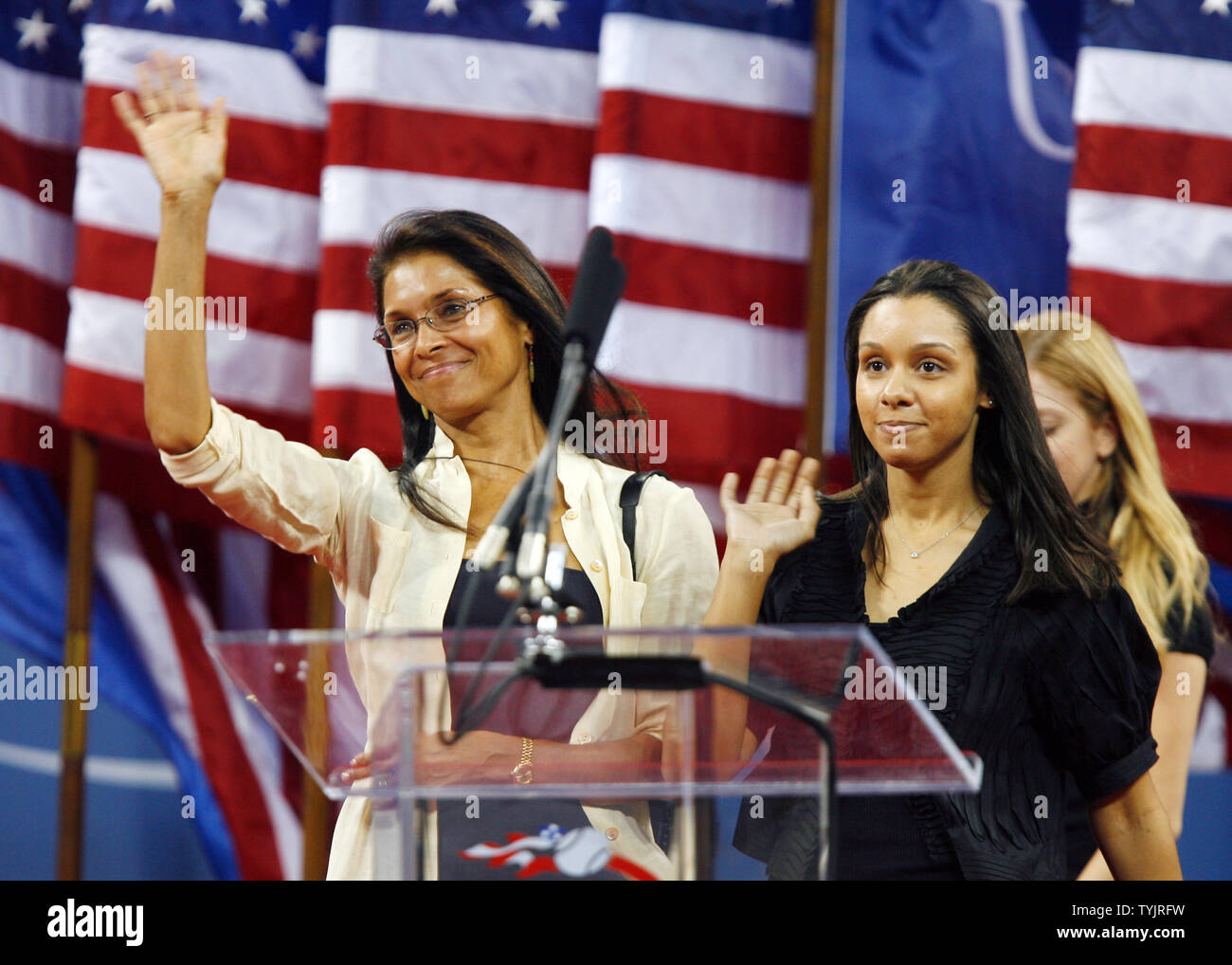 Jeanne Moutoussamy Ashe and Camera Ashe (R) acknowledge the applause