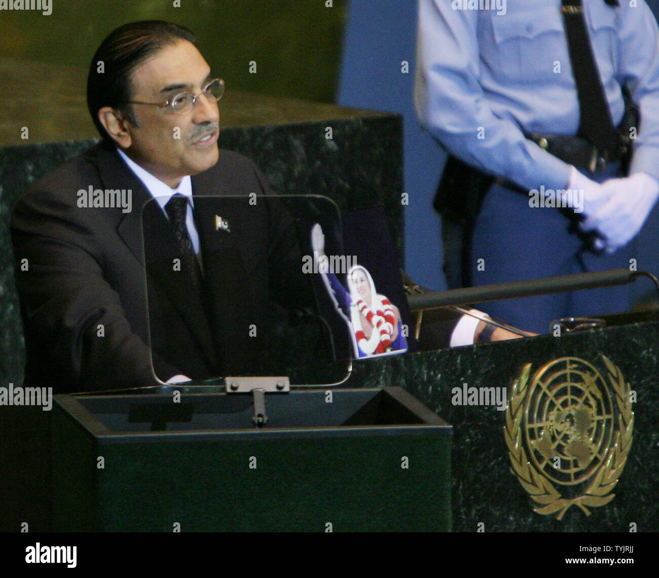 Asif Ali Zardari, President of Pakistan and husband of Benazir Bhutto, addresses the 63rd session of the General Assembly as he displays a photo of the assassinated political leader at the United Nations on September 25, 2008 in New York City. (UPI Photo/Monika Graff) Stock Photo