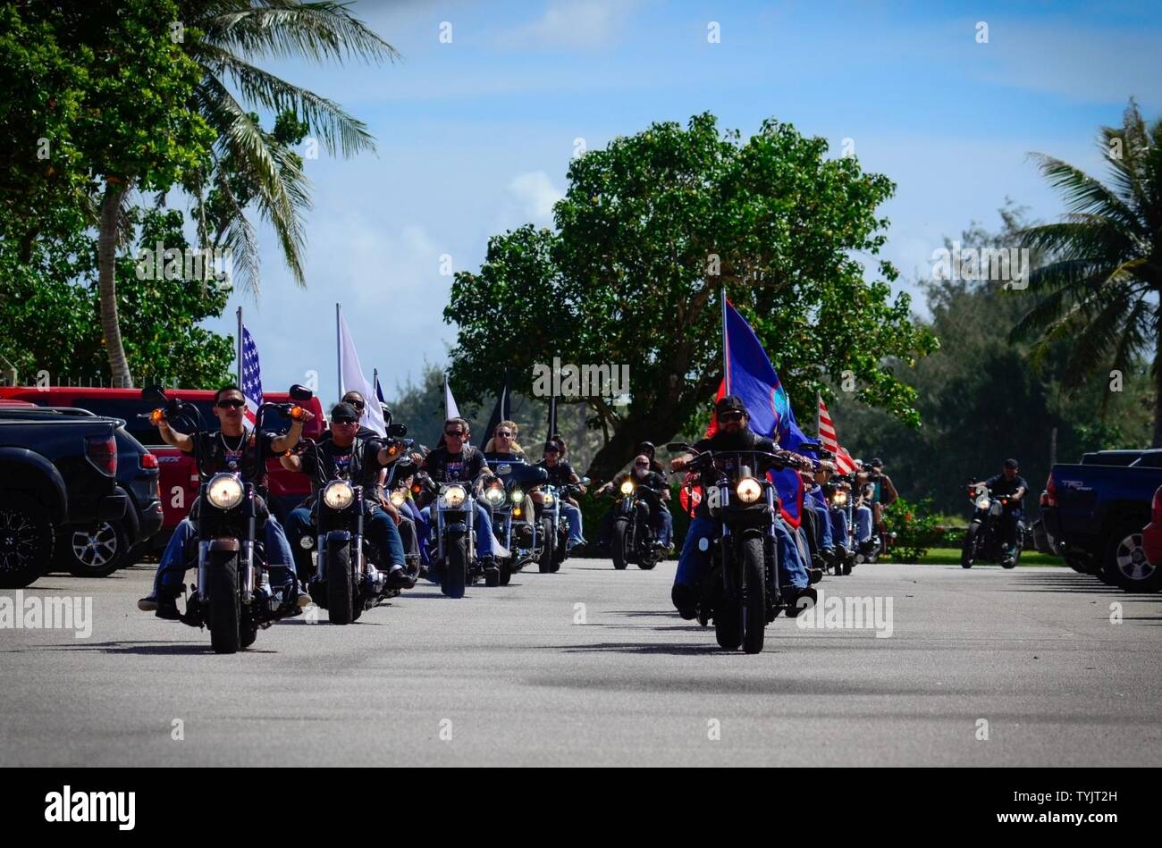 Motorcyclists ride in a memorial ride for fallen warriors, Nov. 11, 2016, at the Governor's Complex in Adelup, Guam. On Veterans Day, Americans nationwide pay tribute to generations of men and women who have served and still serve in uniform. Stock Photo