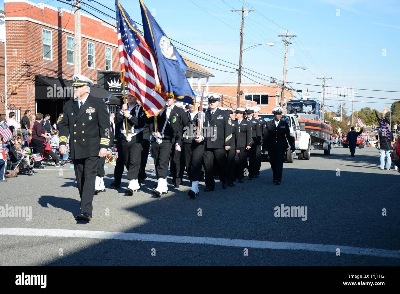 LEONARDTOWN, Md. (Nov. 11, 2016) - Capt. Scott Starkey, Naval Air Station Patuxent River commanding officer, leads Sailors from the installation in the Leonardtown Veterans Day Parade in downtown Leonardtown, Md. Nov. 11. Personnel from Naval Air Station Patuxent River joined members of the local community in the largest parade in the state of Maryland which closed with statements from local elected officials and Starkey. Stock Photo
