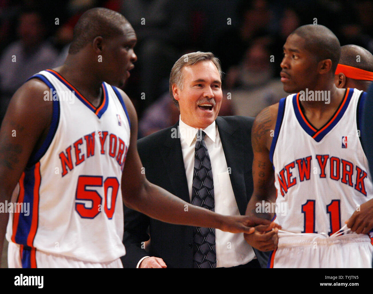 New York Knicks head coach Mike D'Antoni smiles while standing between Zach  Randolph (50) and Jamal Crawford in the second quarter against the Miami  Heat at Madison Square Garden in New York