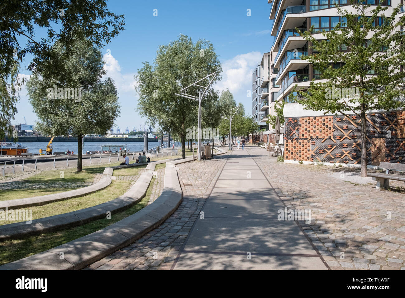 Street scene along Elbe river waterfront promenade, Dalmannkai, Hafencity, Hamburg, Germany Stock Photo