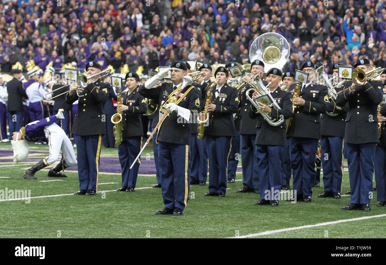 JOINT BASE LEWIS-MCCHOROD, Wash. – Soldiers from the I Corps Band perform the Star Spangled Banner alongside the University of Washington Marching Band prior to the Washington Huskies and USC Trojans football game in Seattle Nov. 12. The I Corps Band performed both America the Beautiful and the Star Spangled Banner as part of UW’s Salute to Service. Stock Photo