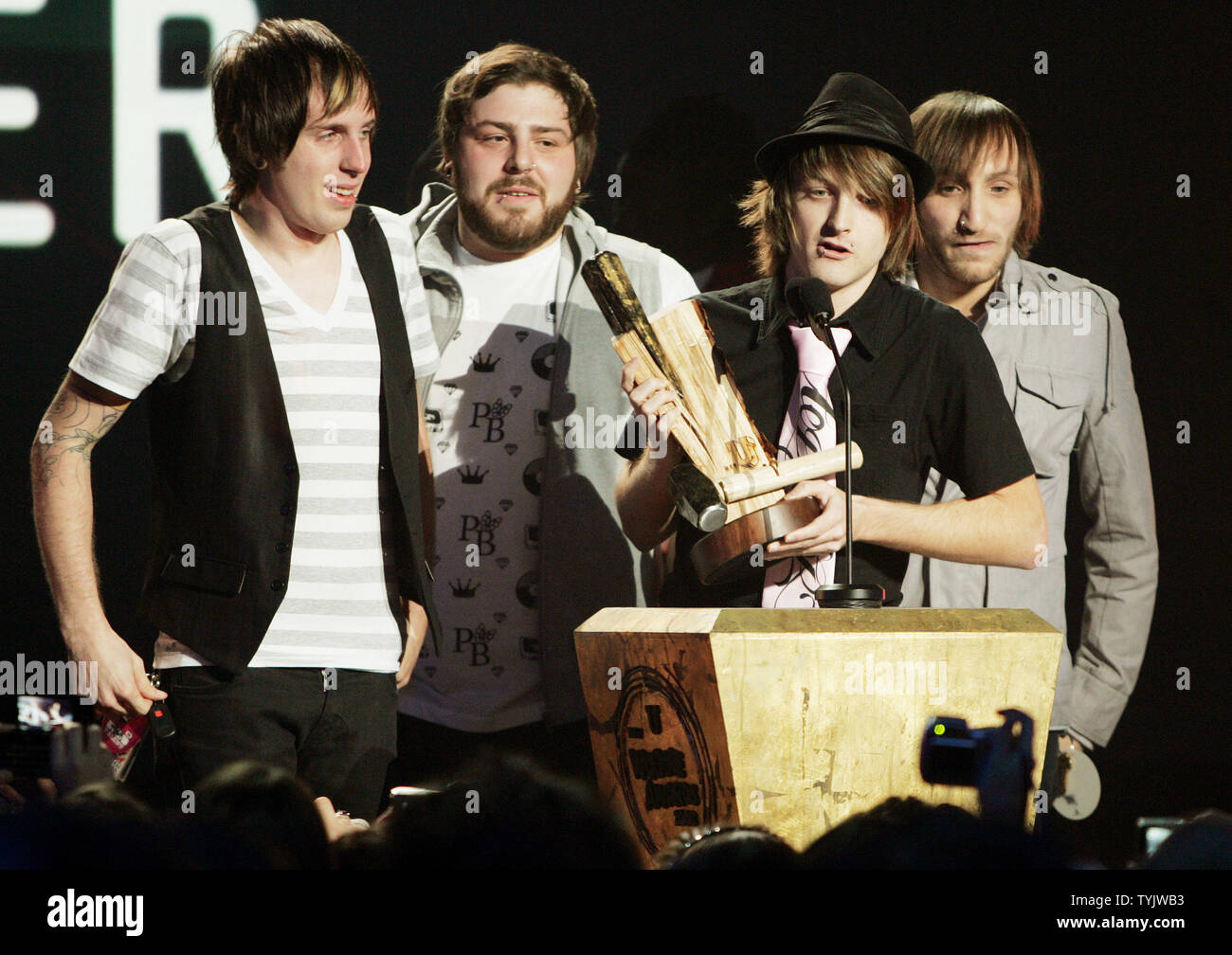 Members of the rock band Bride Wore Black band accept the Best Music on