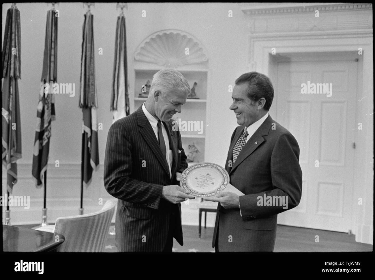 Senator Dominick presenting the President with a dinner plate from the  Republican fundraising dinner; Scope and content: Pictured: Senator Peter  Dominick, President Nixon. Subject: Congress - Individual Stock Photo -  Alamy