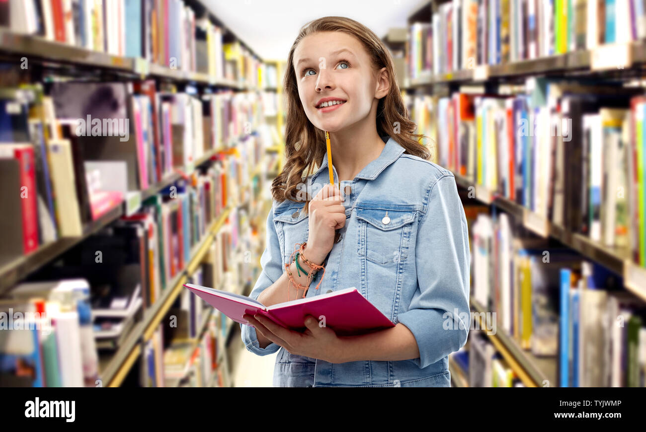 student girl with diary or notebook at library Stock Photo - Alamy