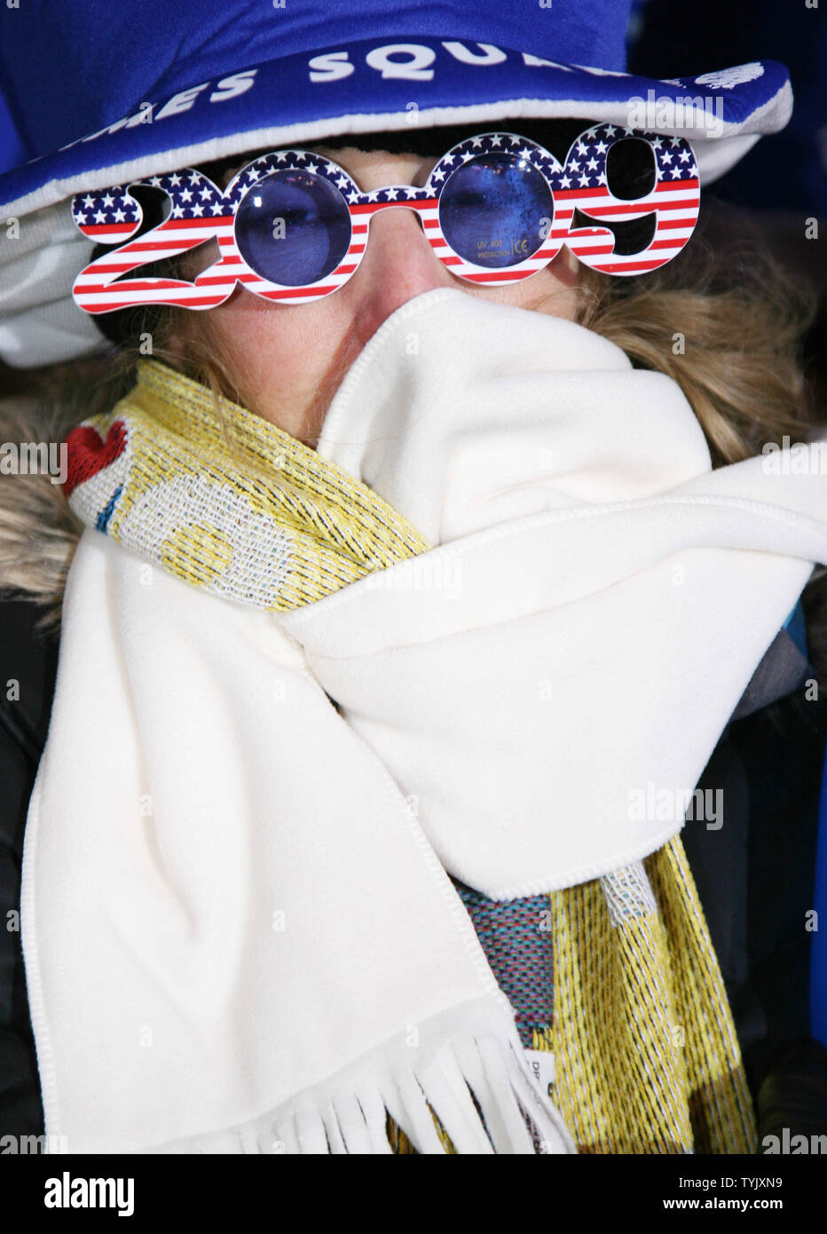 Deri Diaz of Naples, Florida tries to keep warm as she joins the thousands of revelers gathered in Times Square in sub-freezing temperatures as they celebrate New Year's Eve on December 31, 2008 in New York City. (UPI Photo/Monika Graff) Stock Photo