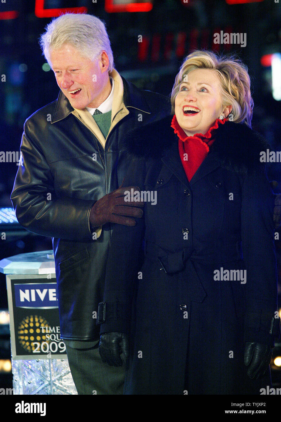 Former President Bill Clinton and his wife U.S. Senator Hillary Rodham Clinton (D-NY) embrace at midnight in Times Square during the New Year's Eve celebration on December 31, 2008 in New York City. (UPI Photo/Monika Graff) Stock Photo