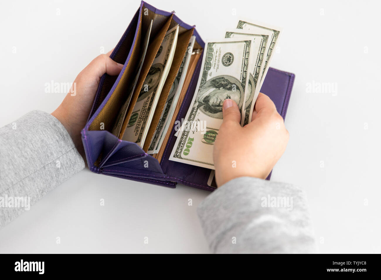 close up of woman hands with wallet and us money Stock Photo