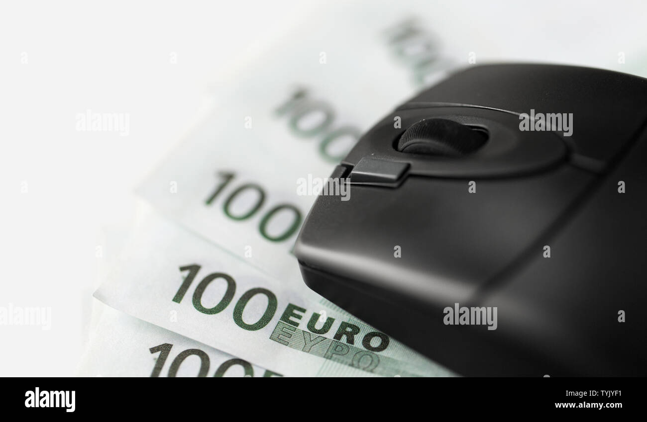 close up of computer mouse on euro money Stock Photo