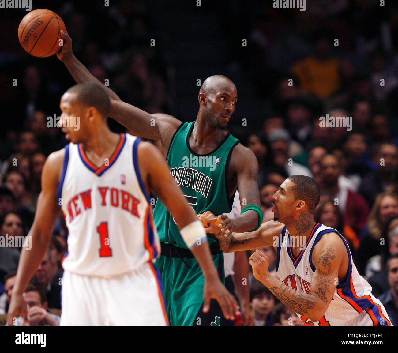 Boston Celtics Kevin Garnett (5) is defended by New York Knicks Wilson Chandler and Chris Duhon in the fourth quarter at Madison Square Garden in New York City on February 6, 2009. The Celtics defeated the Knicks 110-100.    (UPI Photo/John Angelillo) Stock Photo