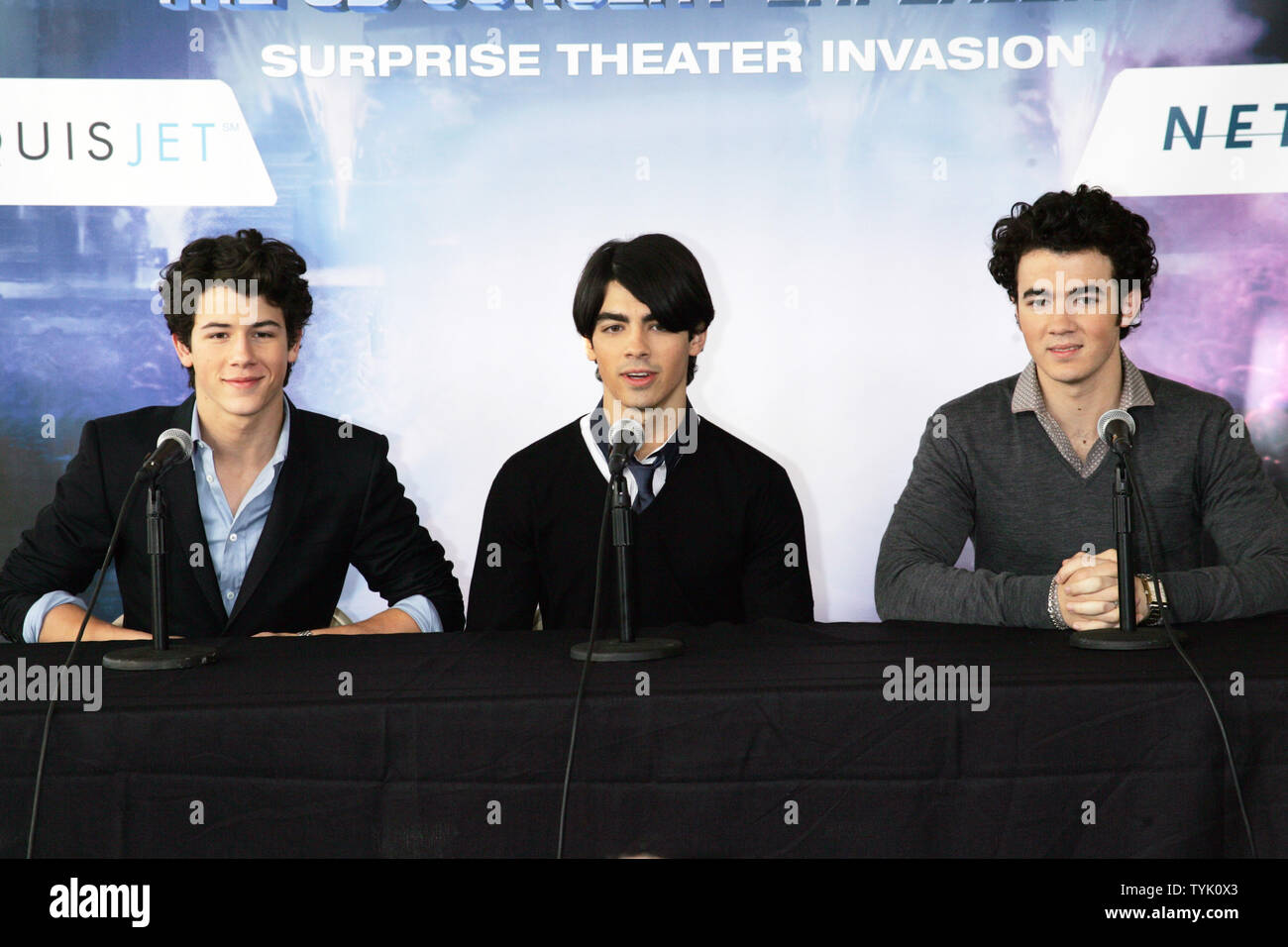 The Jonas Brothers (L-R) Nick, Joe and Kevin attend a press conference about embarking on their 'Surprise Theater Invasion' at the Westchester Airport in New York on February 28, 2009.  (UPI Photo/Laura Cavanaugh) Stock Photo