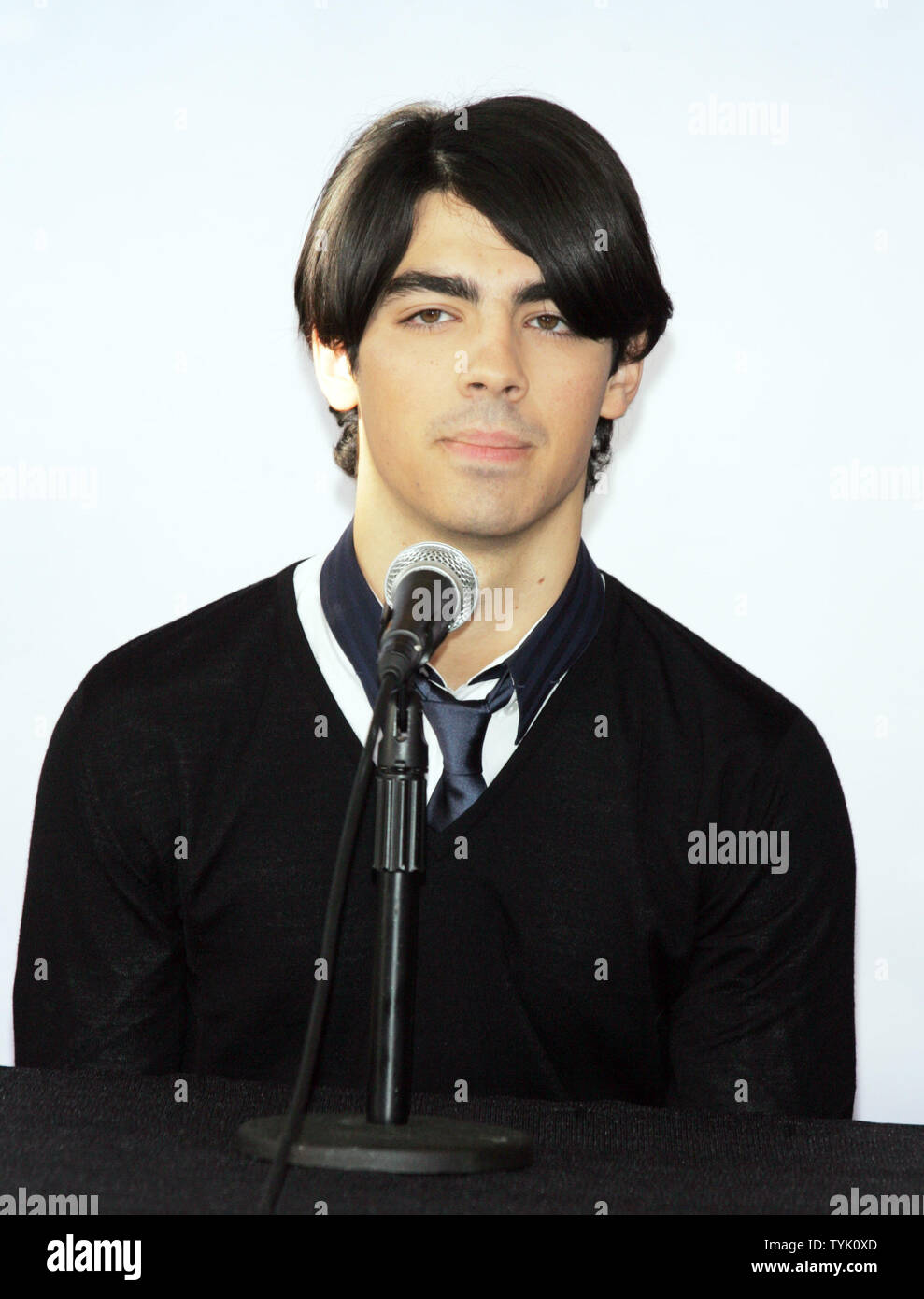 The Jonas Brothers' Joe Jonas attends a press conference about embarking on their 'Surprise Theater Invasion' at the Westchester Airport in New York on February 28, 2009.  (UPI Photo/Laura Cavanaugh) Stock Photo