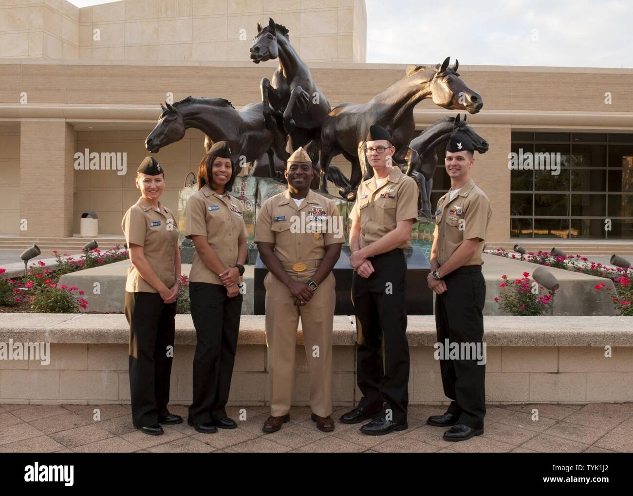(COLLEGE STATION, Texas) USS George H.W. Bush (CVN 77) Command Master Chief Huben Phillips and the Sailors of the Year for the aircraft carrier USS George H.W. Bush (CVN 77) pose for a portrait during a tour of Texas A&M University in College Station, Texas. The tour is part of a two-day namesake trip to Texas where Sailors engaged with the local community about the importance of the Navy. Stock Photo