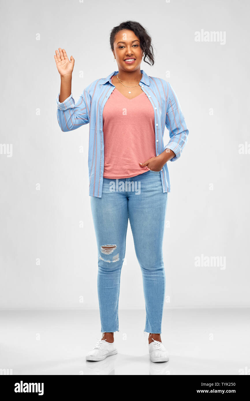 happy african american woman waving hand Stock Photo - Alamy