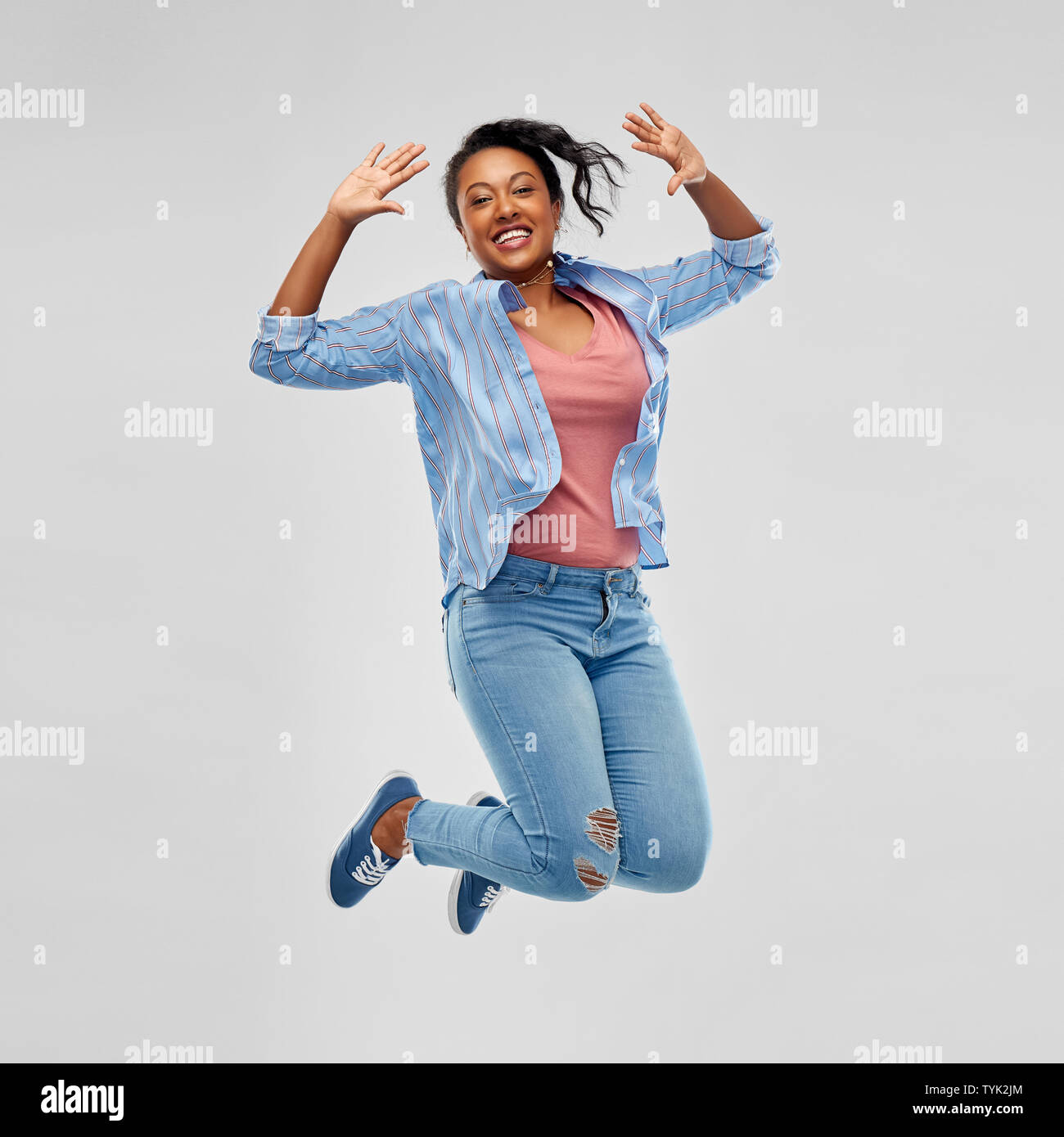 happy african american woman jumping high Stock Photo - Alamy