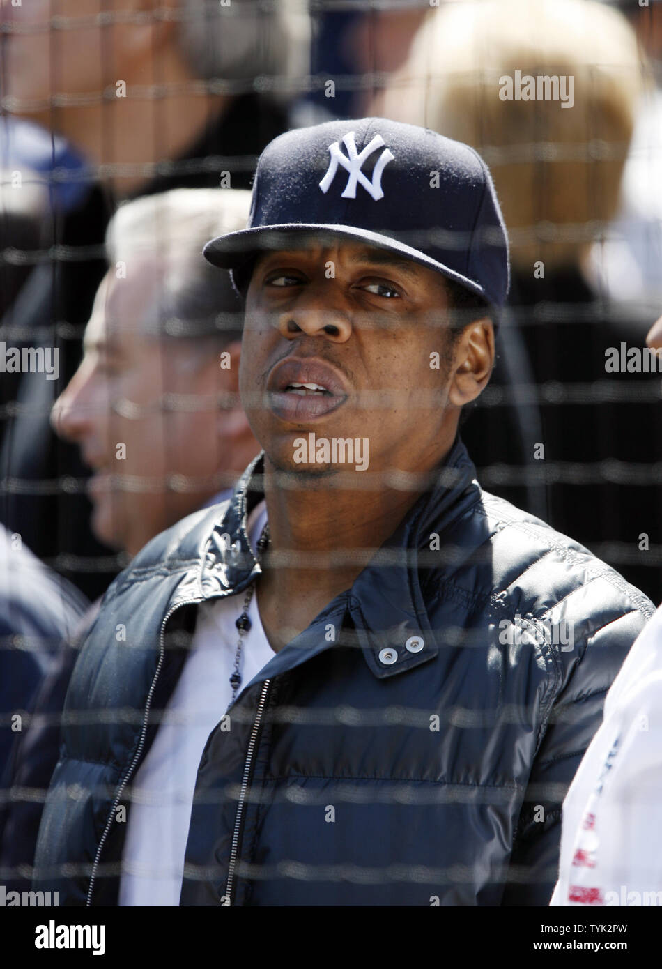 Jay-Z stands up near his seats before the New York Yankees play