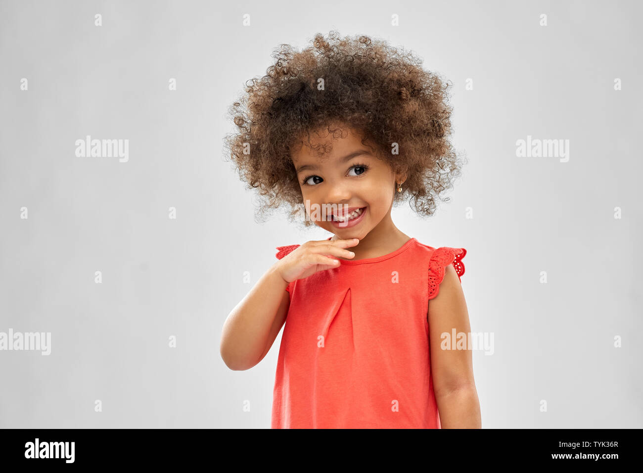 happy little african american girl over grey Stock Photo - Alamy