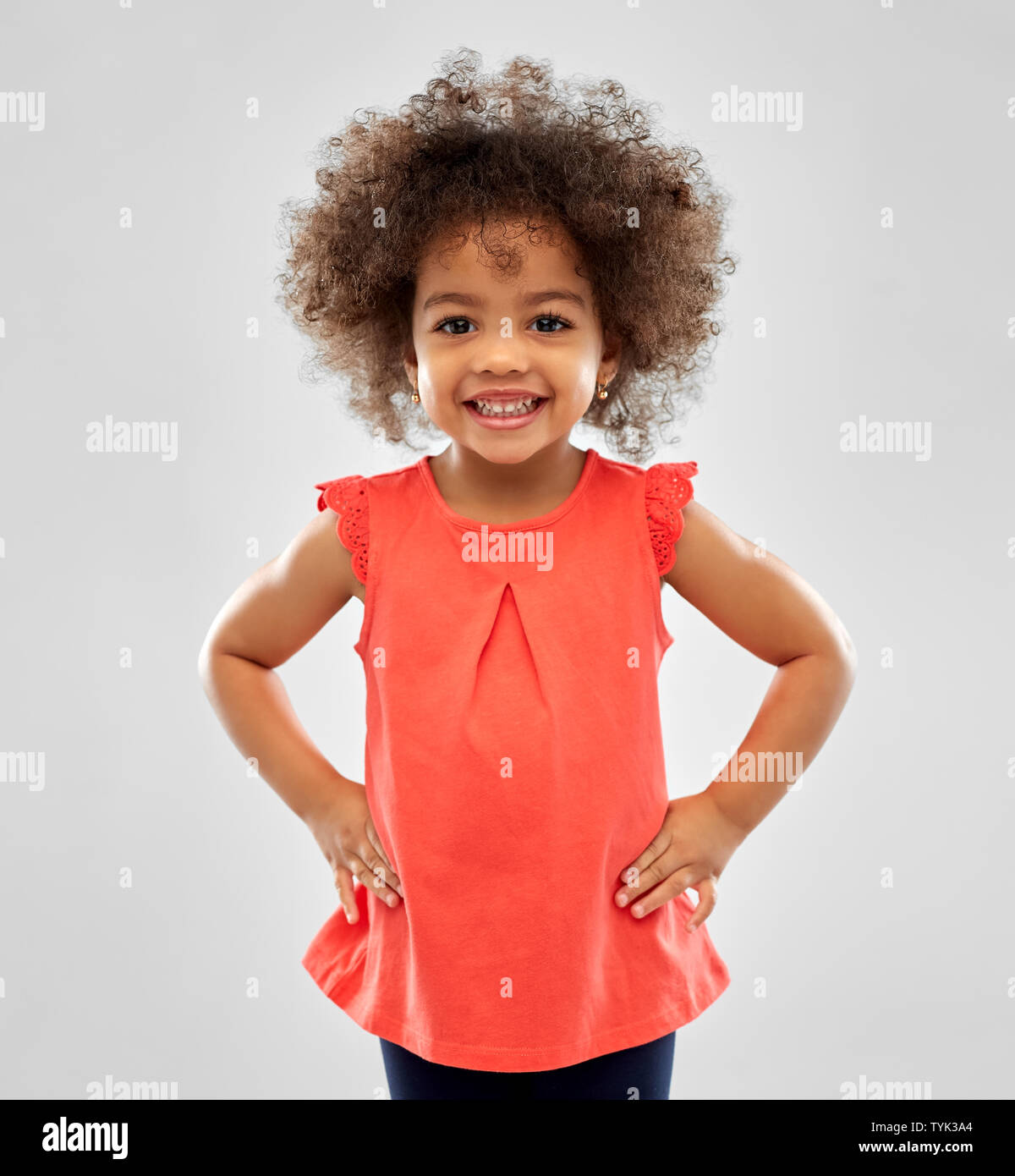 happy little african american girl over grey Stock Photo - Alamy