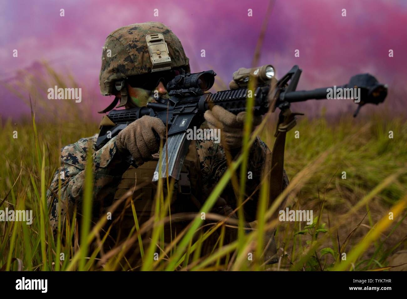 SABAH PROVINCE, Malaysia (November 13, 2016) A Marine with Battalion Landing Team 1st Battalion, 4th Marines, sights in with his rifle while conducting the final exercise during Exercise Tiger Strike 2016 in Sabah Province, Nov. 13. The 11th Marine Expeditionary Unit and Malaysian forces conducted Tiger Strike from November 9 – 13 with both forces training in jungle survival, Marine Corps Martial Arts, non-lethal weapons, helicopter loading and offloading, combat service support and also shared cultural exchanges between the two nations. Stock Photo